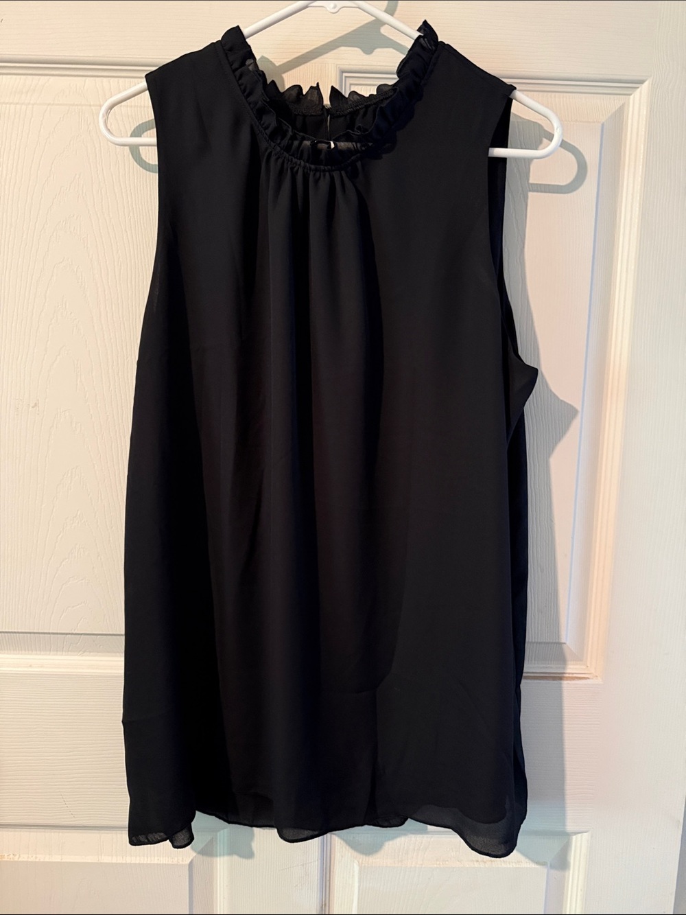 Black Sleeveless Ruffle-Neck Blouse